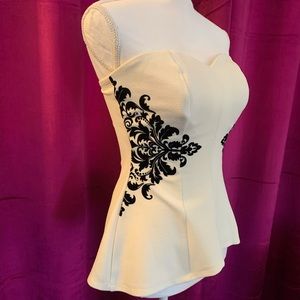 Size S material girl. Super cute cream and black top. Worn once and stretchy!